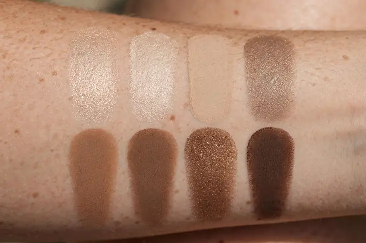 Eyeshadow swatches in neutral matte and shimmer shades on skin